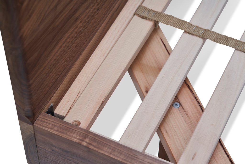 Close up of solid timber on divine bed